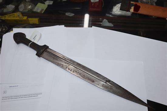An Eastern dagger with leaf-shaped fullered blade, horn grip set metal bosses and wooden scabbard (a.f) L.50cm